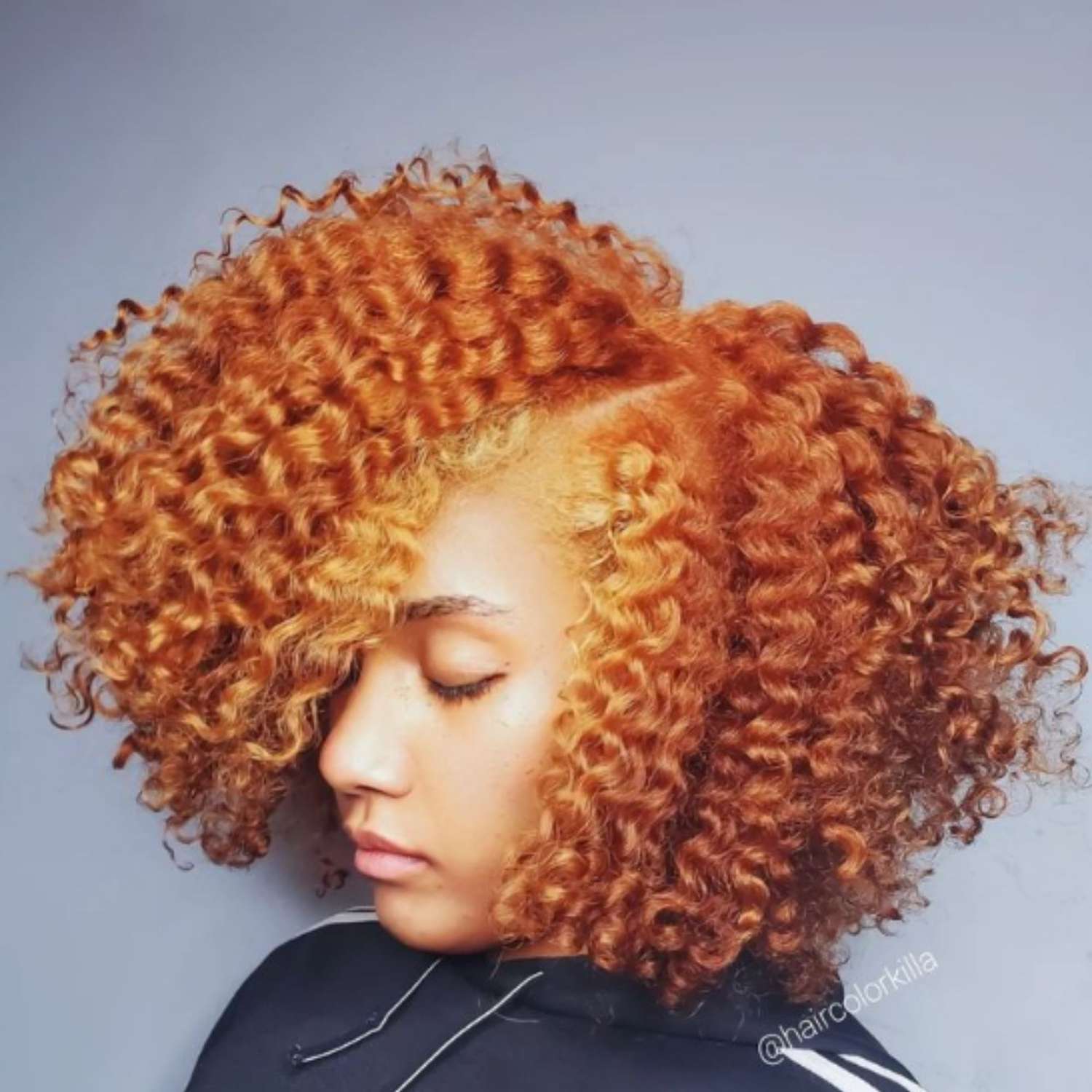 Two-toned auburn hair on a bold afro.